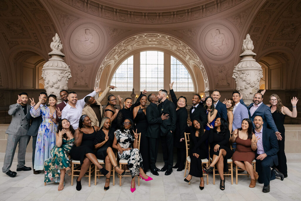 A group of people celebrating a newlywed couple.