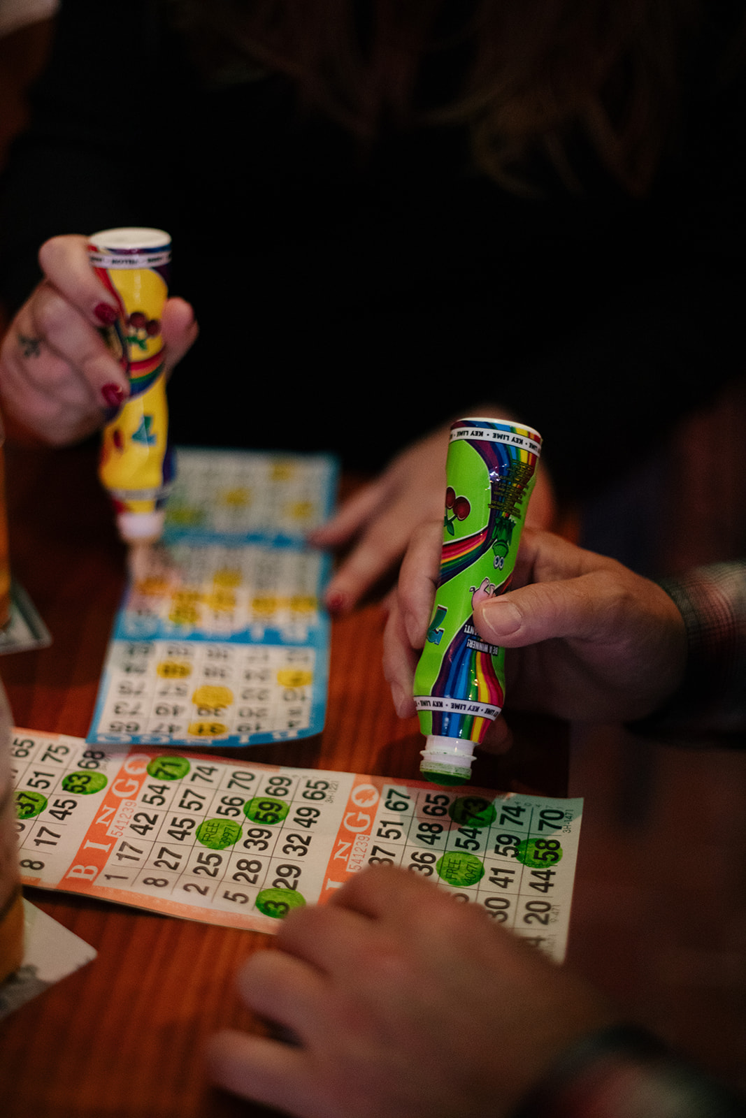 two people playing bingo in a bar