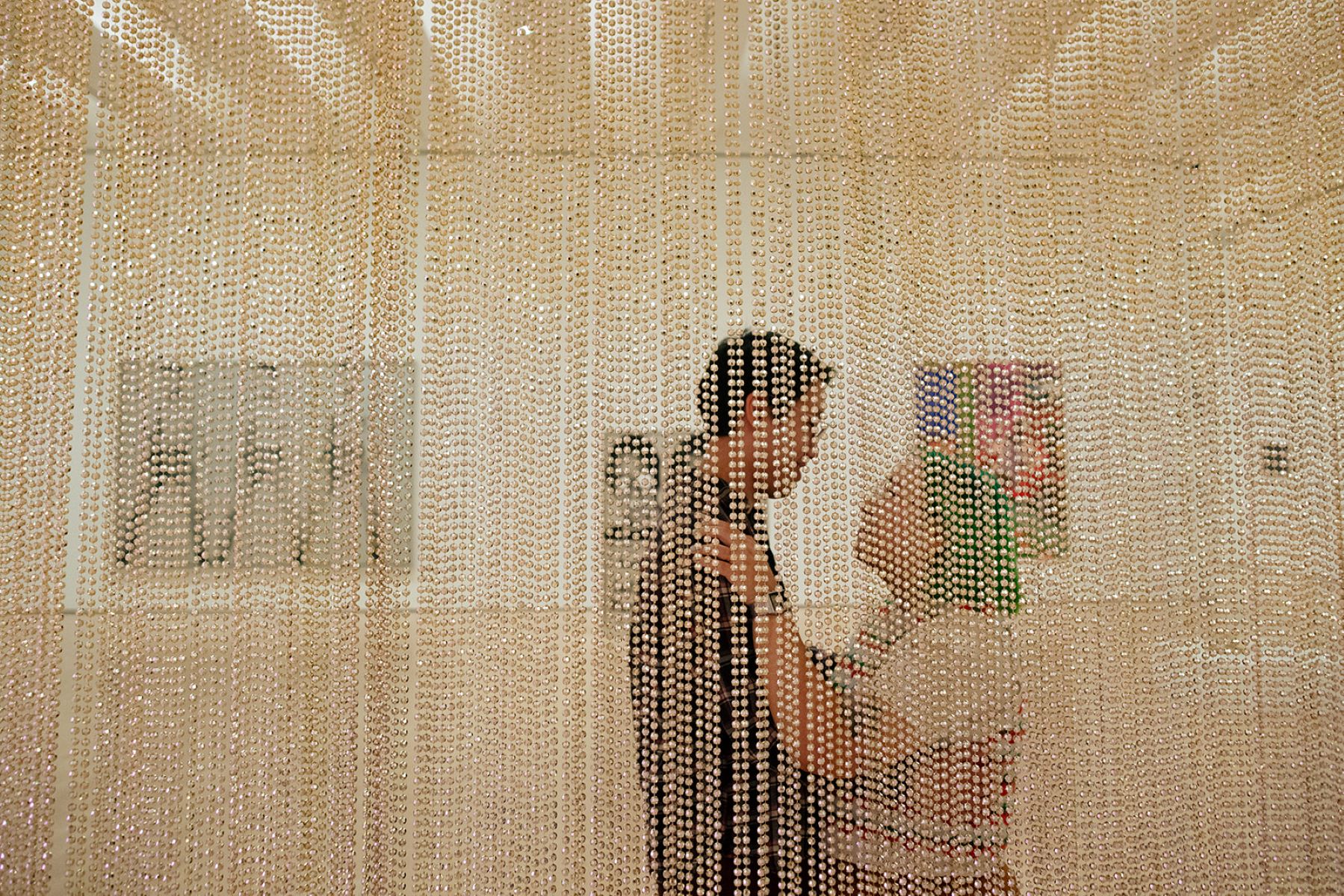 a couple taking engagement photos inside of MOMA in san francisco