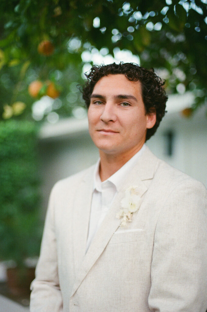 a close up portrait of a wedding groom taken on 35mm film
