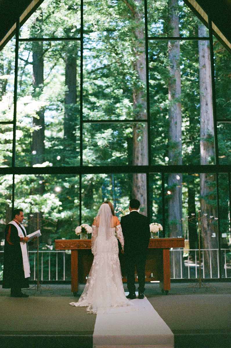 a couple standing at the altar for their wedding captured on film 