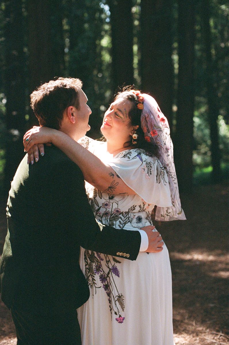 a couple embracing at their wedding ceremony captured on film 