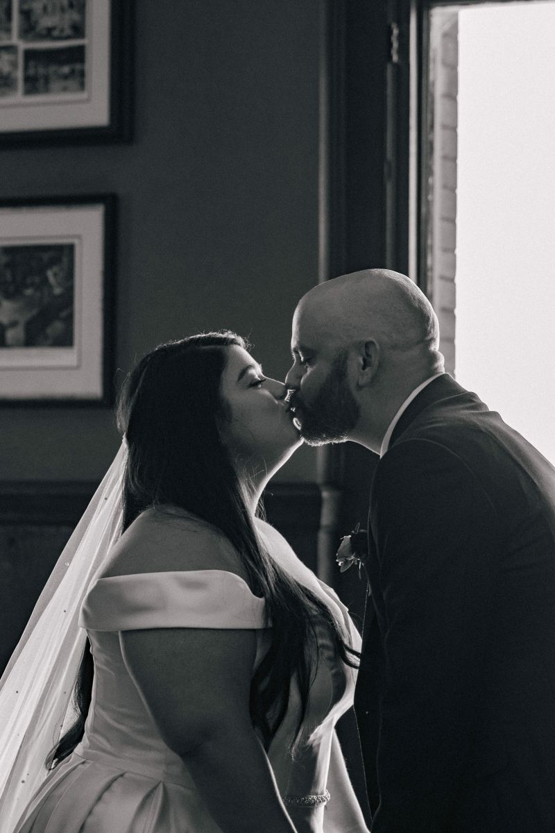 a couple kissing at the University Club of San Francisco