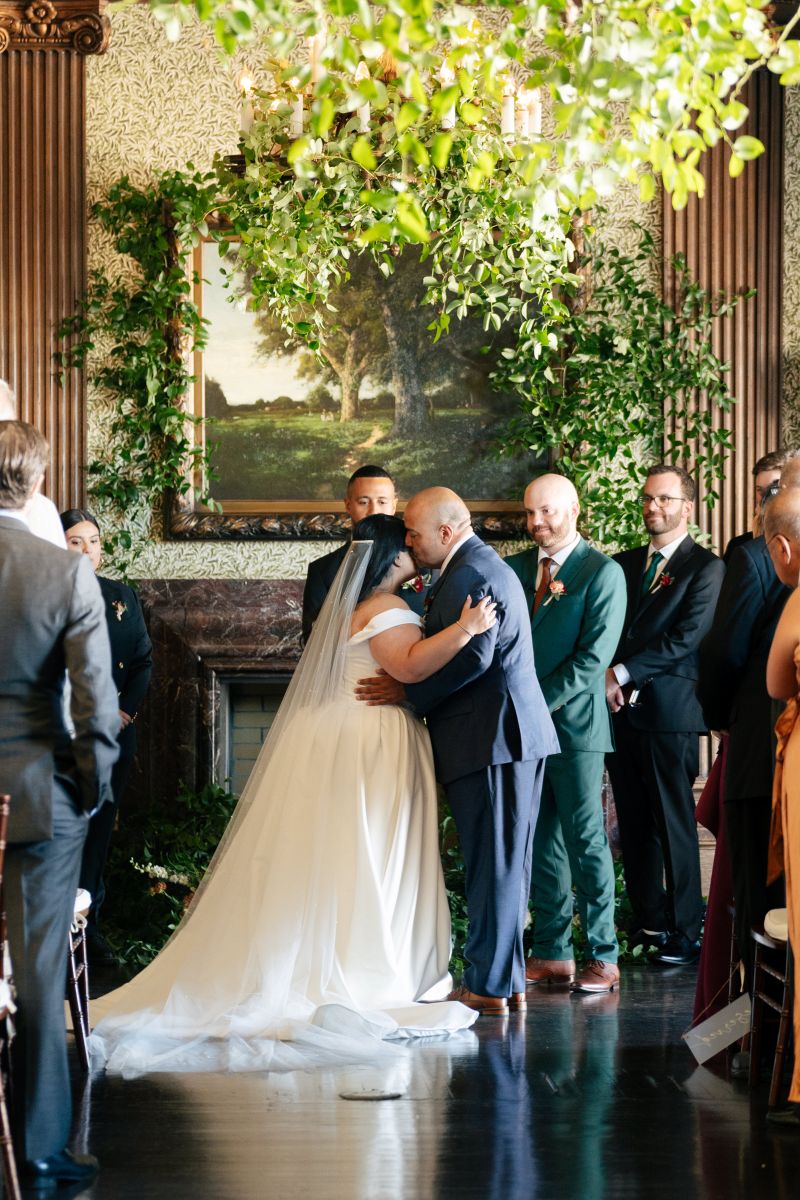 a woman parting with her father at her wedding ceremony 