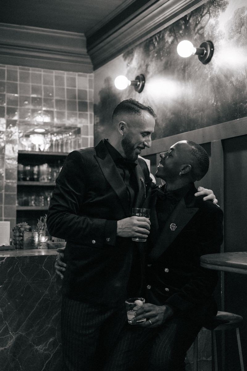 a couple embracing each other inside of fiorella sunset