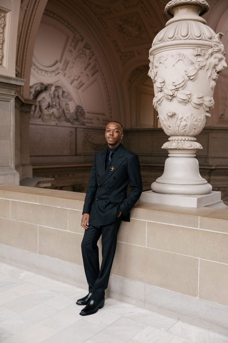 a man taking portraits on the 4th floor of san francisco city hall
