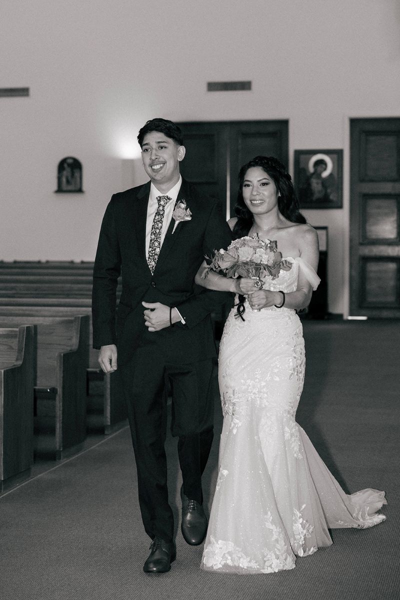 a brother walking his sister down the aisle on the day of her wedding 