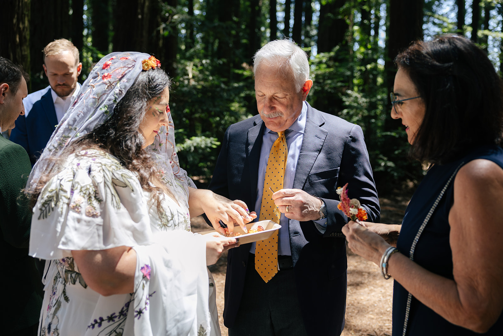 a bride with her family on the day of her wedding in roberts regional park 
