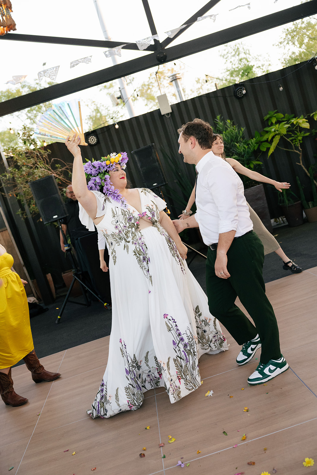 a bride and groom dancing together at their wedding reception at nido's backyard 
