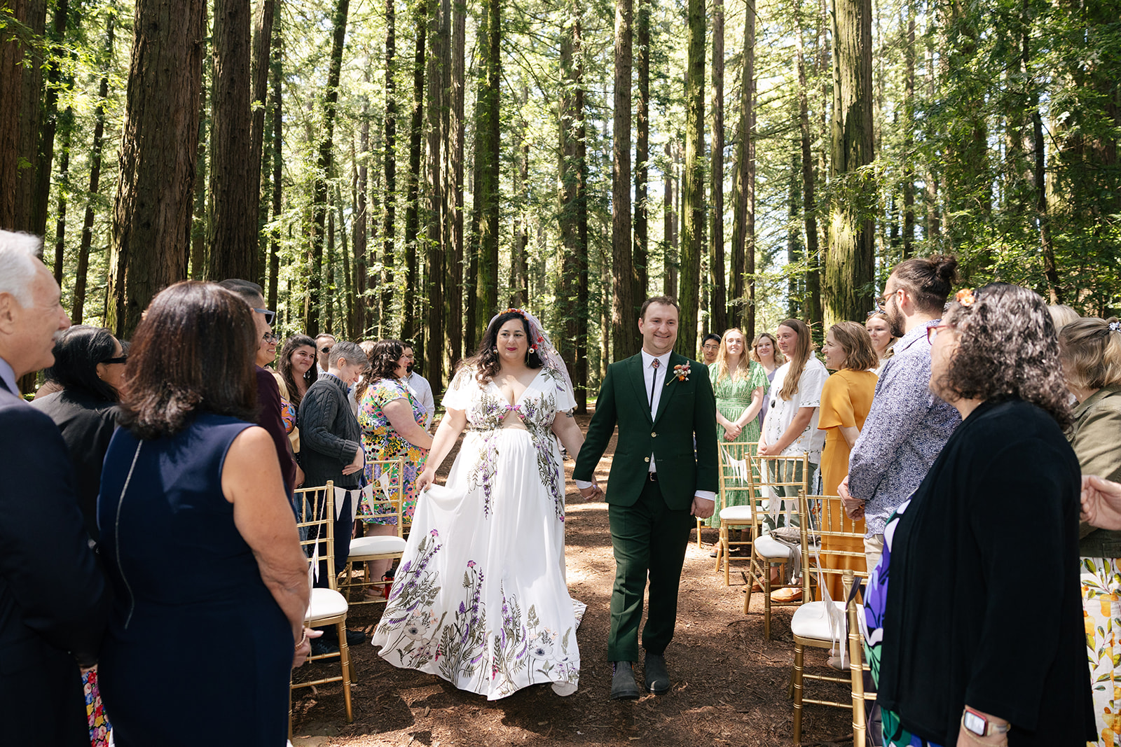 a couple walking hand in hand down the aisle for their wedding in roberts regional park 