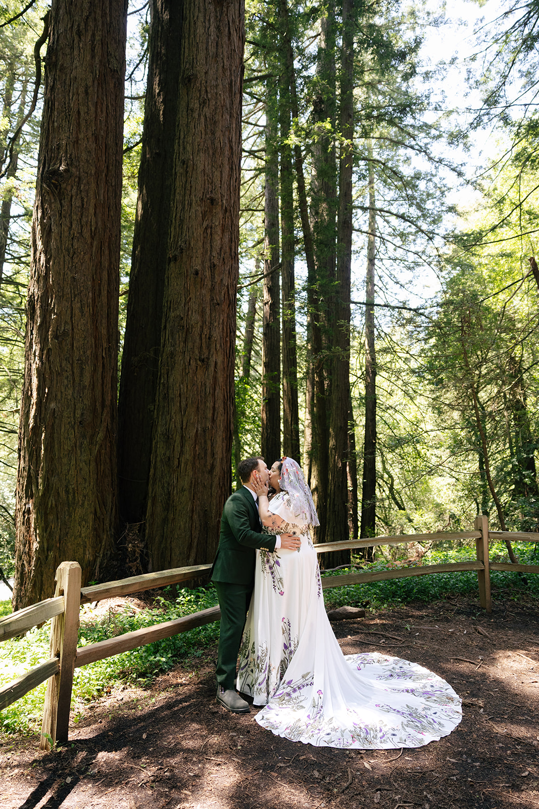 a couple taking couple wedding portraits in roberts regional park 
